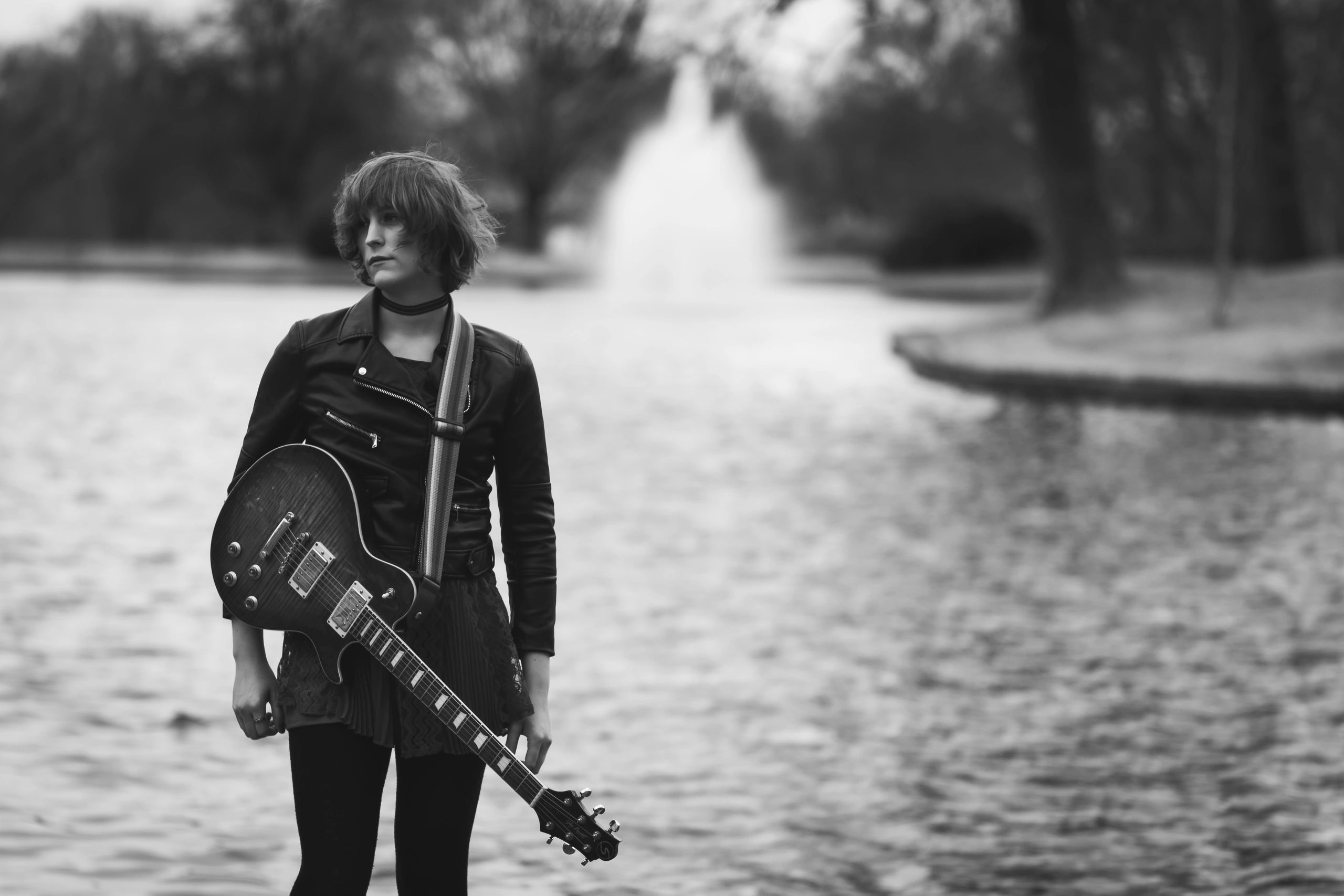 Guitarist on rural road